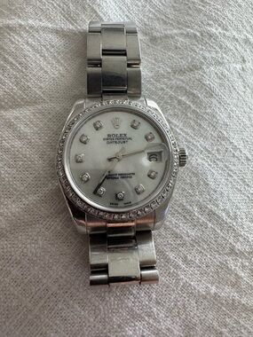 Rolex Silver Stainless Steel Watch with White Dial and Diamond Markers